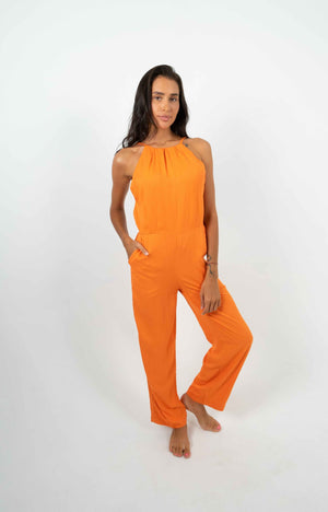 
            
                Load image into Gallery viewer, Fluid orange backless jumpsuit. Two front pockets.
            
        