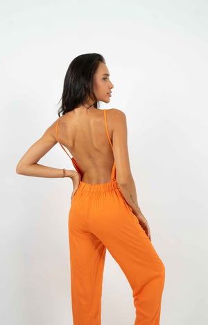 
            
                Charger l&amp;#39;image dans la galerie, Orange backless jumpsuit. Gathered elastic waistband and back zipper.
            
        