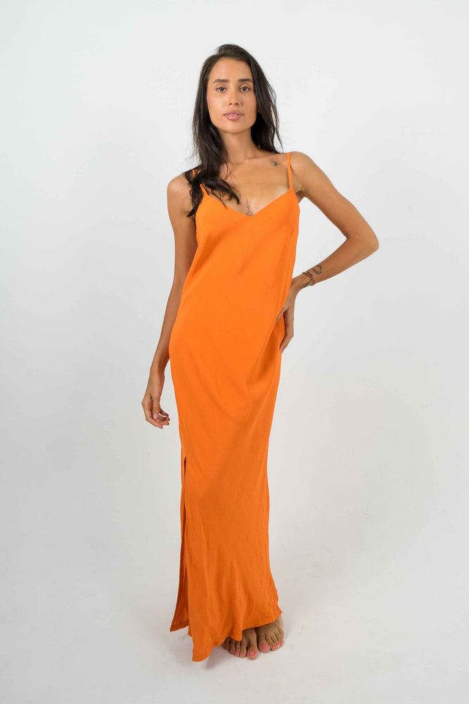 
            
                Load image into Gallery viewer, Long flowing orange backless dress. With thin straps. Split on the left side
            
        