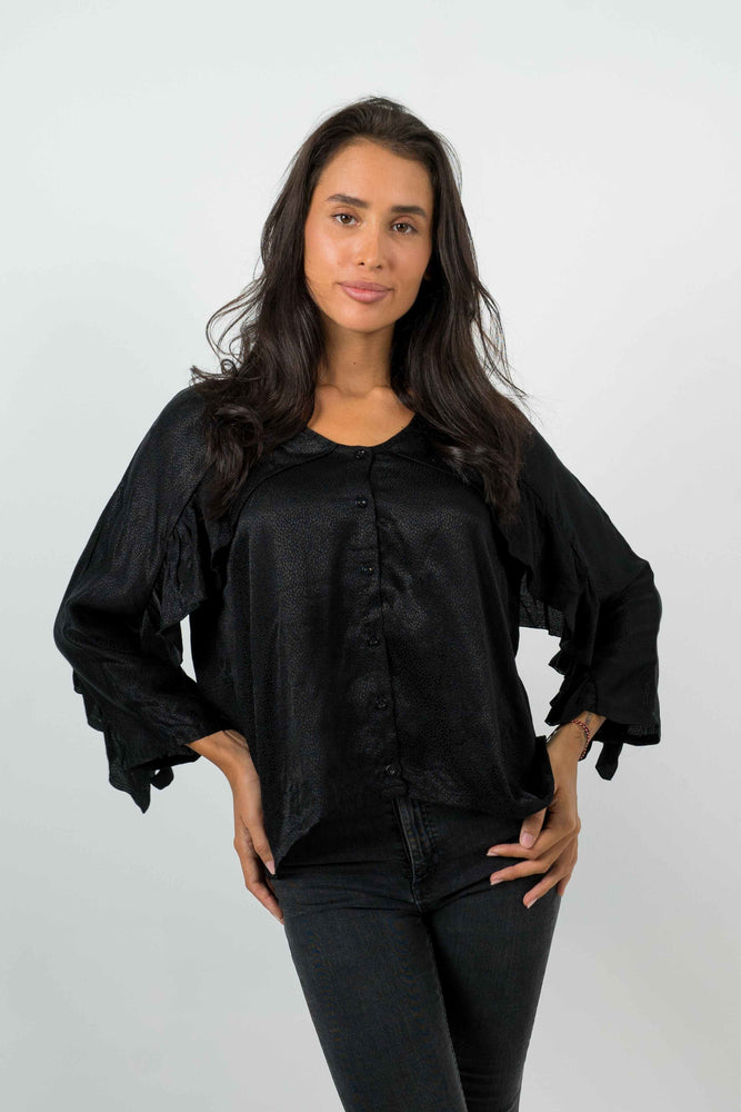 Black open back shirt, with ruffled sleeves. Textured satin material.