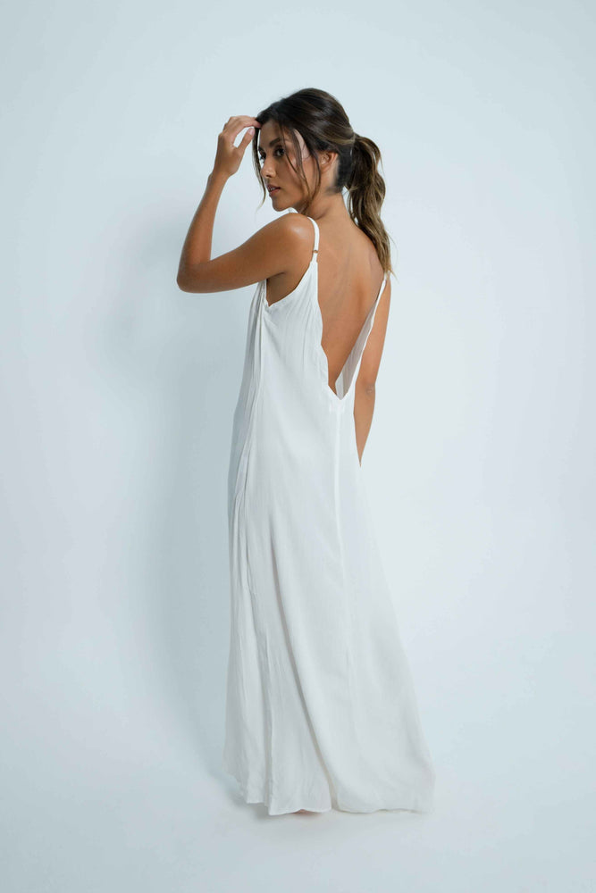 Long white dress with a plunging bare back. Adjustable straps and a cloud detail on the necklines.