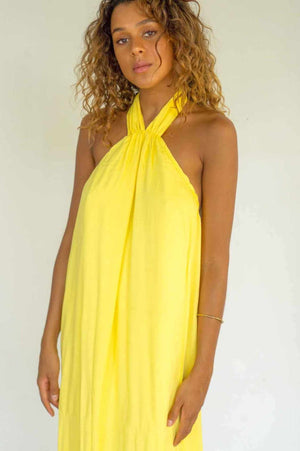 Long yellow open back dress, adjustable with a knot that tightens in the neck.