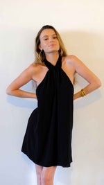 Mini black open back dress, adjustable with a knot that tightens in the neck.