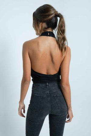 Full bare back on this elegant black top. It can be tied at the front or the back with a knot.