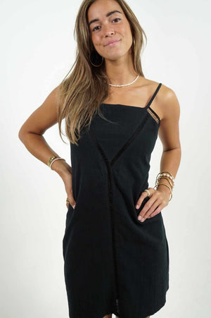 Cute mini dress in black by Back Cartel. With details at the front and wide opening at the back.