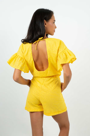 
            
                Charger l&amp;#39;image dans la galerie, Open back playsuit with ruffle shoulder and adjustable lace at the neck. From Back Cartel.
            
        