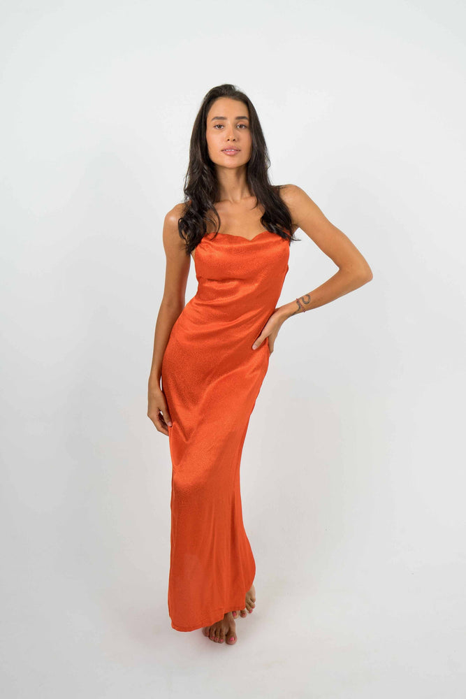 This maxi sleek dress hugs your curves for that killer silhouette. Party dress in tangerine, adjustable open back, by back cartel.
