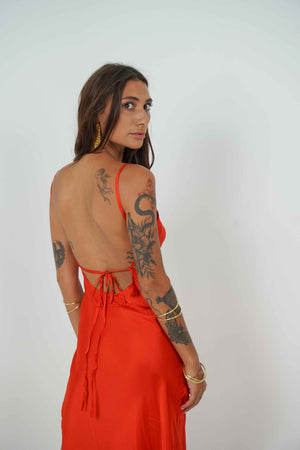 This model has a beautiful back, and even more when she's wearing a red backless dress.