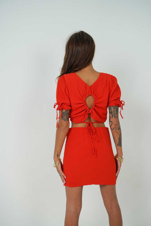 Open back crop top with adjustable laces and mini skirt by Back Cartel. The French brand specialised in backless outfits.