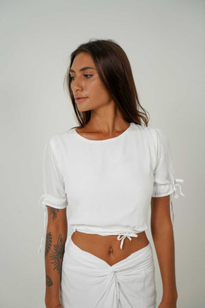 
            
                Load image into Gallery viewer, Cute white outfit by Back Cartel: get the Jack crop top and the Rose mini skirt for a comfy and street look.
            
        
