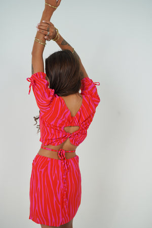 the Jack Backless top with adjustable lace in pink zebra from Back Cartel